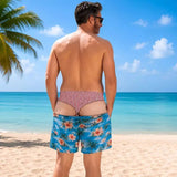 Cheeky Swim Trunks Tropical print, back view on the beach